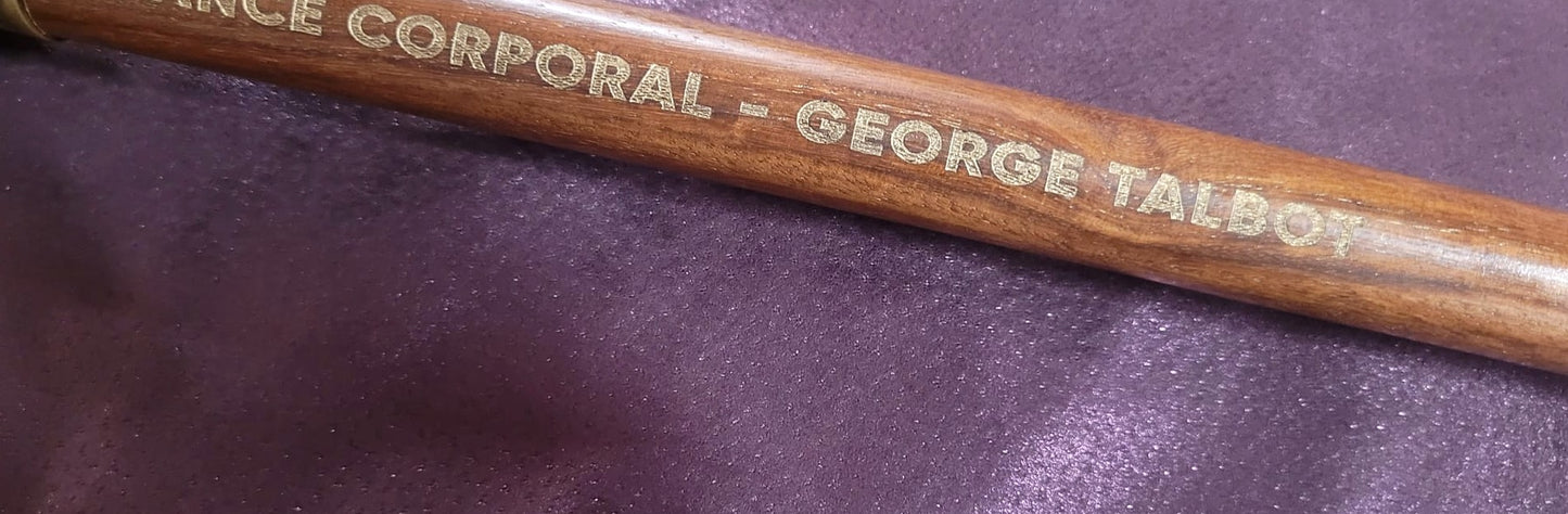 Close crop of laser engraved letters and dates on wood, Moon Groves