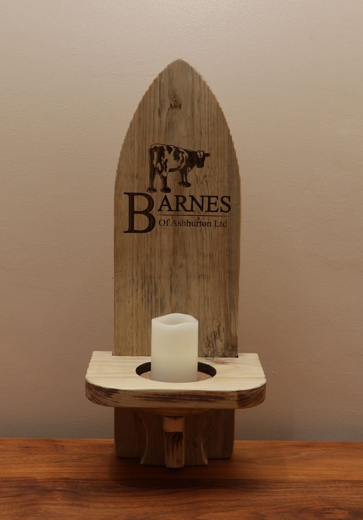 Detail of a personalised wooden wall candle sconce laser-engraved in Ivybridge Devon