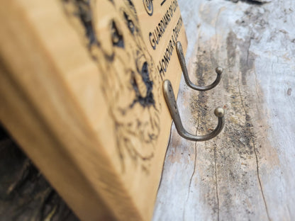 Close-up of laser engraving on solid wood dog lead hanger – handmade in Devon UK by Moon Groves
