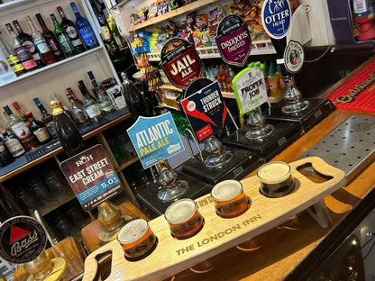 Beer flight board with glasses in situ at home pub – custom laser engraved by Moon Groves Devon