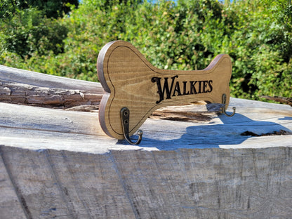 Close-up of Walkies laser engraving on wooden dog lead holder – handmade in Devon UK