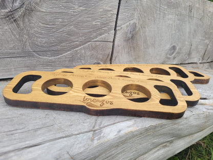 Custom laser engraved beer flight board showing individual paddle wells – handmade in Devon UK