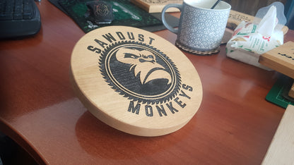 Round wooden wall plaque showing timber grain and laser engraving detail – Moon Groves Devon UK