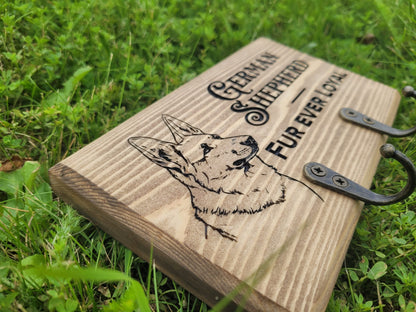 Personalised dog lead hanger in use on wall – custom engraved wooden hook handmade in Devon UK