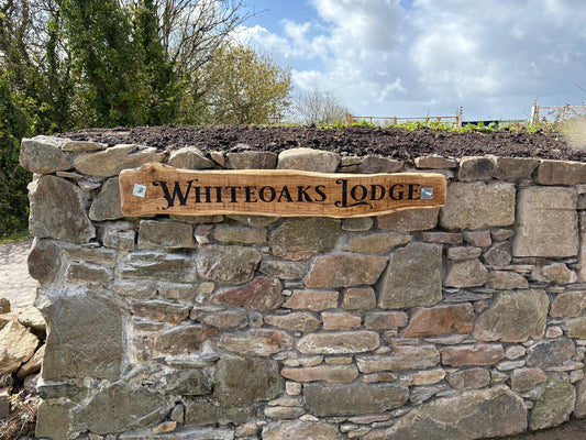 Personalised oak house sign Whiteoaks Lodge on a stone wall, Ivybridge Devon, Moon Groves