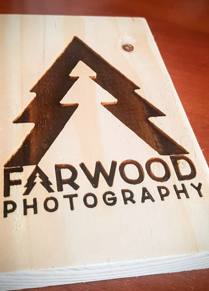 Personalised business logo sign in situ – laser engraved wood handmade by Moon Groves Devon UK