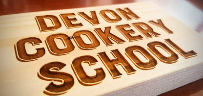 Bespoke custom laser engraved logo sign on wood – business branding by Moon Groves, Devon UK