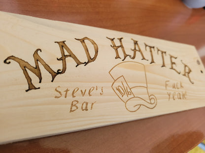 Custom wooden logo sign showing engraving quality – Moon Groves bespoke signage Devon UK