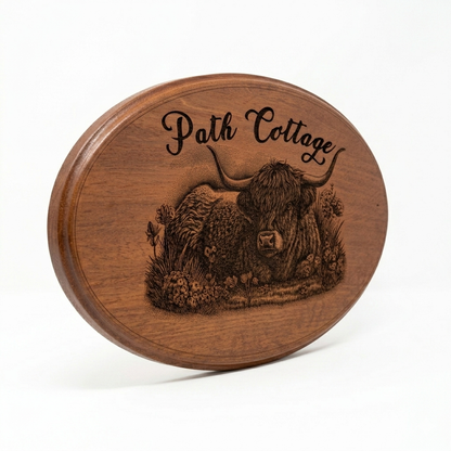 Bespoke engraved wooden oval house sign angled view showing bevelled routed edge and rich mahogany grain – handmade to order by Moon Groves UK