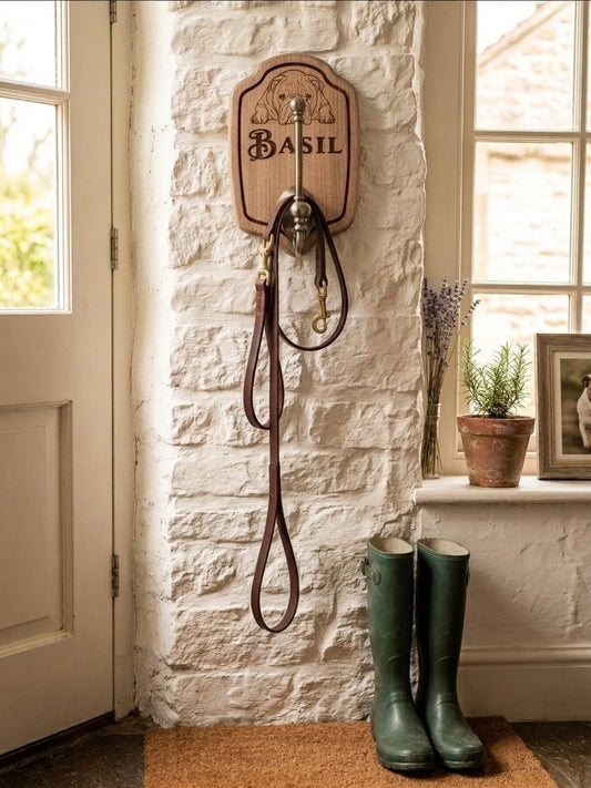 Close-up of laser engraved dog name on wooden wall hook